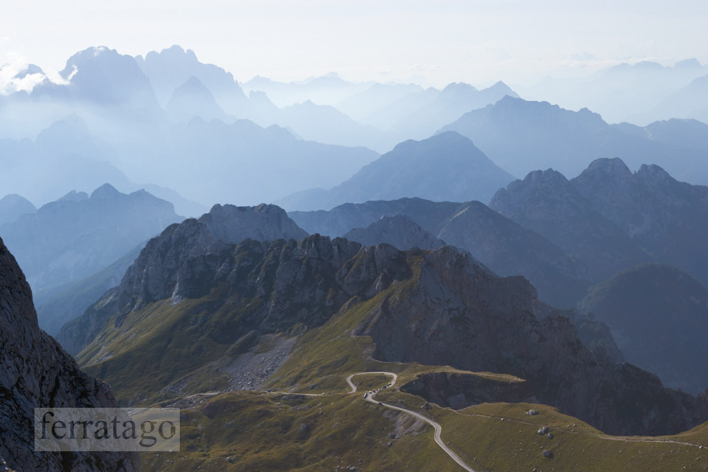 Mountain silhouettes in the Julian Alps, Slovenia, at sunset, in a warm late Summer day, as seen comming down from Mangart peak