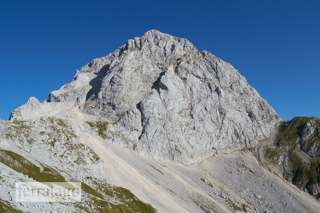 Mangart (or Mangrt) peak, a mountain in the Julian Alps, located on the border between Italy and Slovenia.